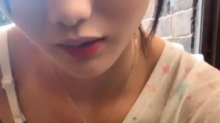 Woman observing and touching her body in natural light
